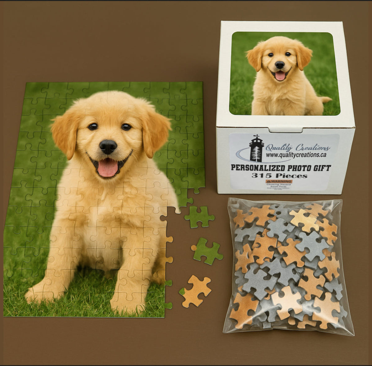 A completed photo puzzle of a golden retriever puppy sitting on green grass, with a matching gift box and bag of loose puzzle pieces beside it. Located in Canada. Salisbury, Saint John, east coast, maritimes, Halifax, Moncton