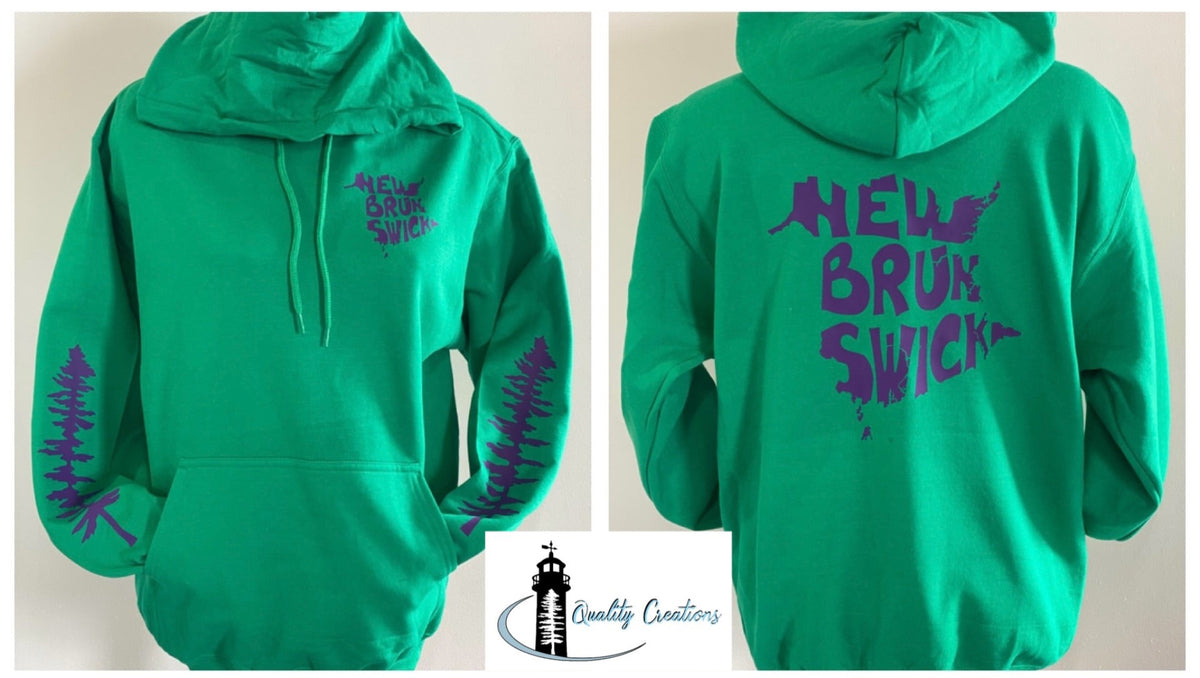 A bright green pullover hoodie shown from both front and back, featuring purple 'New Brunswick' text and tree silhouettes on the front chest and sleeves, and large matching purple text on the back. A small 'Quality Creators' logo appears at the bottom center.