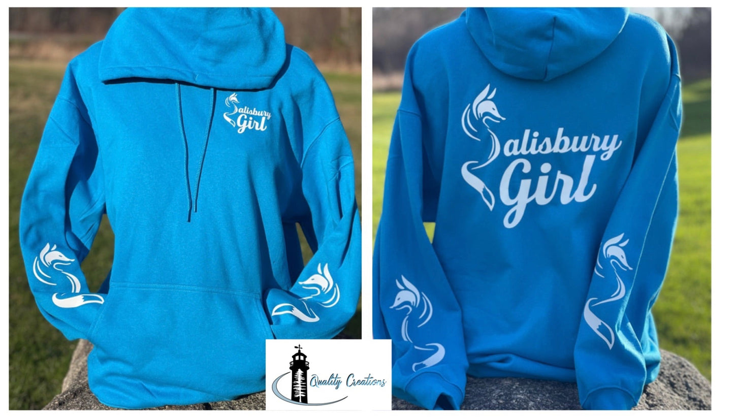 Sapphire blue Salisbury Girl pullover hoodie with white text and fox graphics on both sleeves. Front and back view shown. Designed in Salisbury, New Brunswick—home of the Silver Fox.