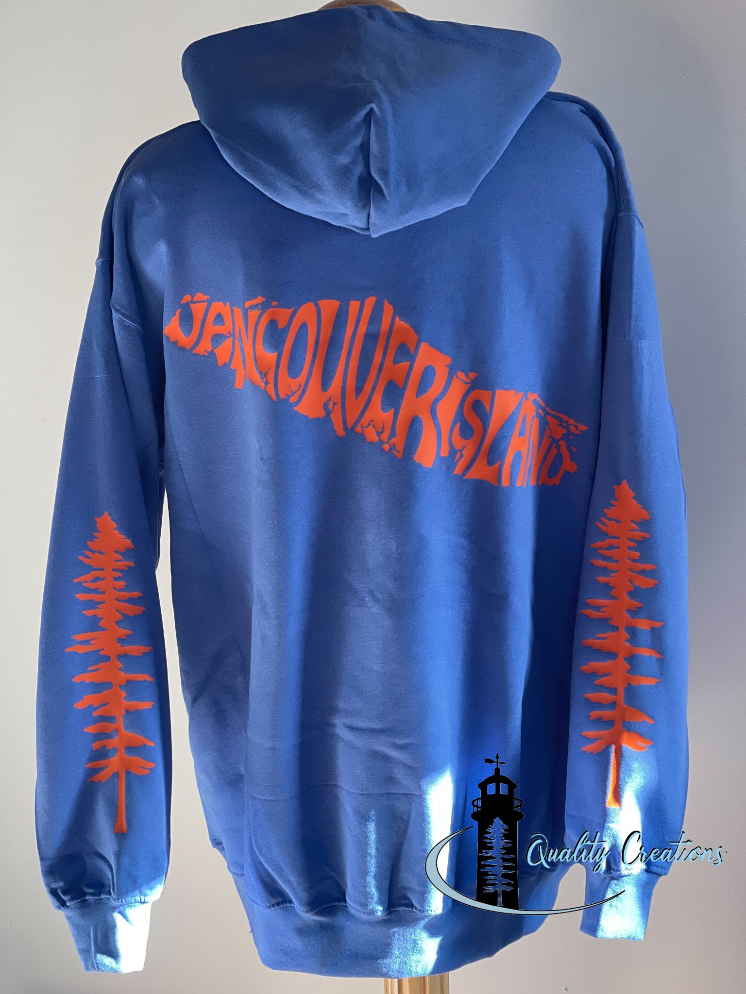 Vancouver island design with Sitka tree on arms, blue hoodie, orange  design font, Campbell river, Courtney, Canada, qualitycreations247, Ontario, newbrunswick, nb, Salisbury, Moncton range 