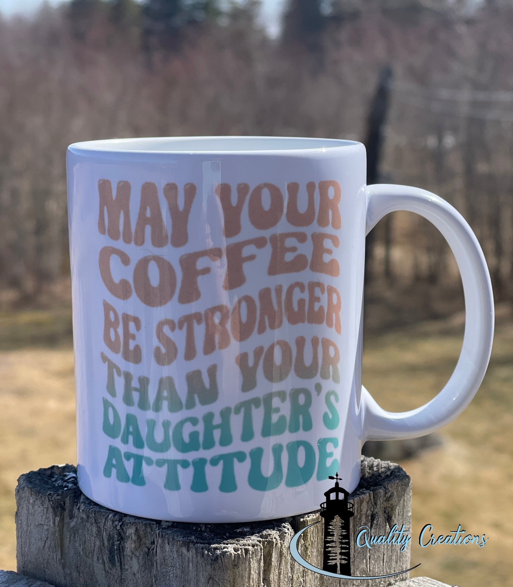 11oz White ceramic mug with the phrase “May your coffee be stronger than your daughter’s attitude” in bold multicoloured text. A funny and relatable gift for moms.