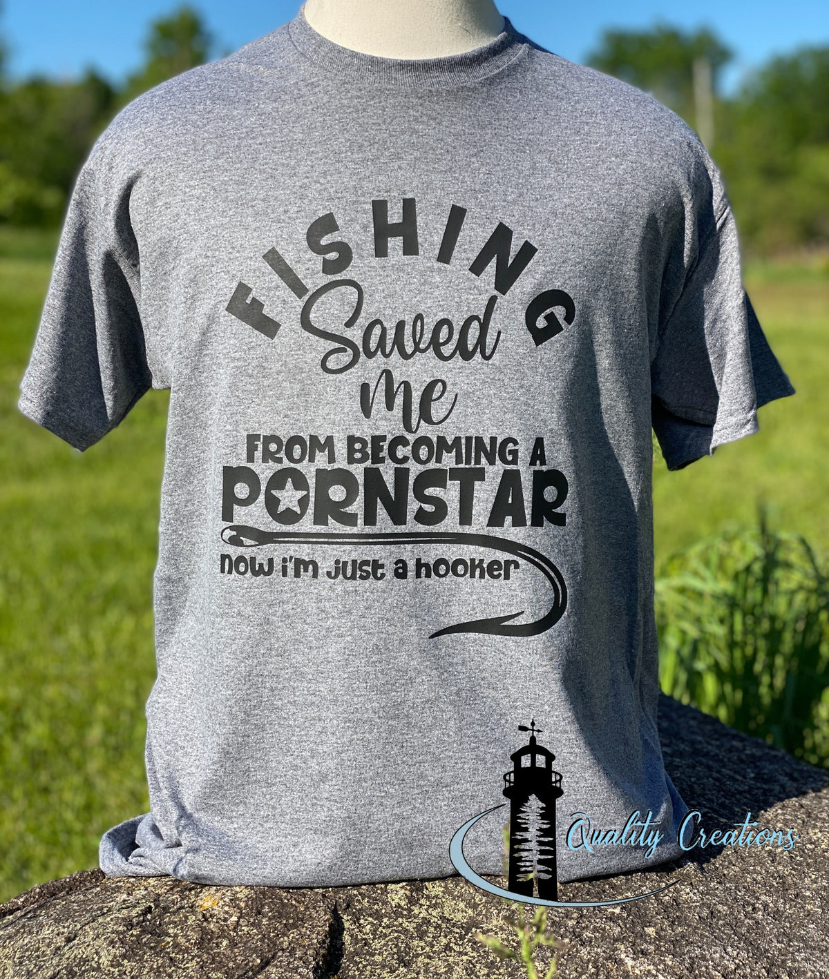 Grey fishing T-shirt with black laddering featuring a funny fishing scene handmade by Quality Creations.Salisbury New Brunswick Canada