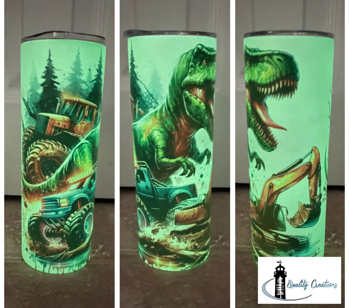 Three views of a tall insulated tumbler with a glowing green dinosaur and construction vehicle design, shown on a dark floor against a gray wall. A Quality Creations logo is visible in the bottom right corner.