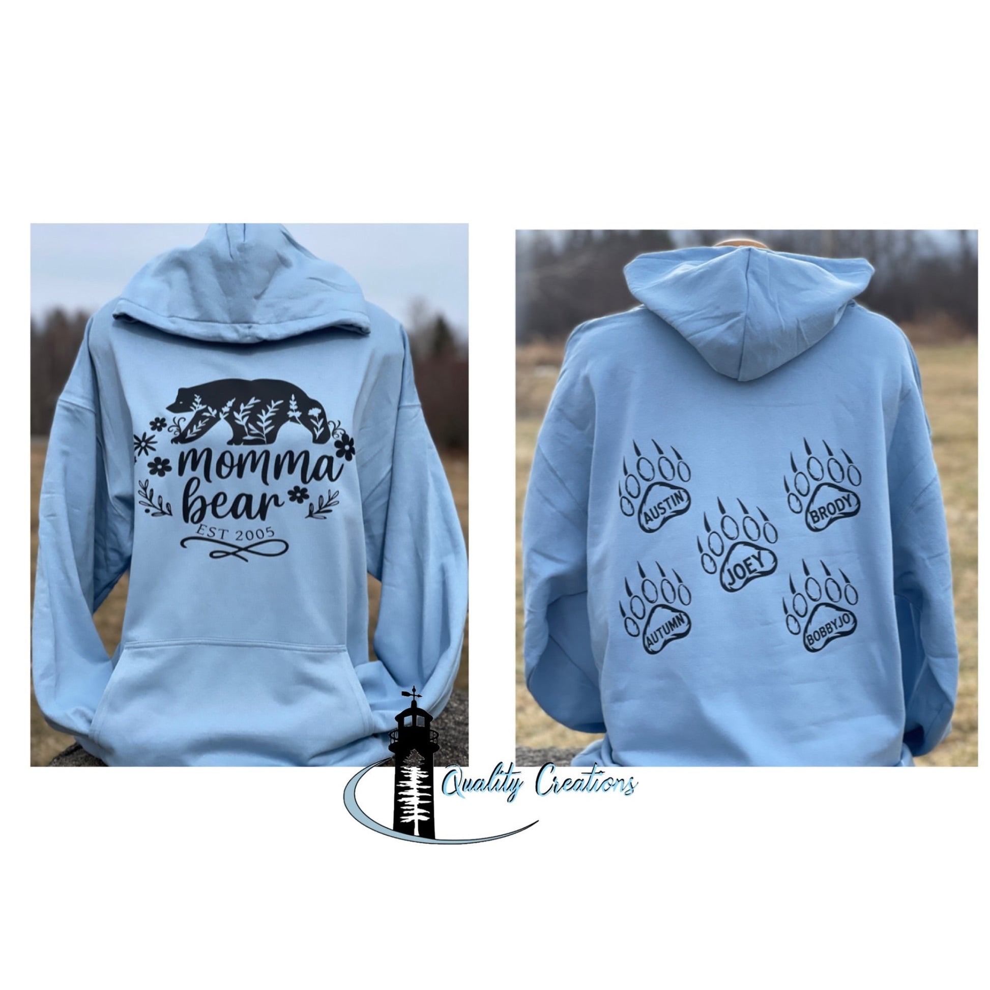 Custom light blue hoodie featuring a Mama Bear mountain design on the front and bear paw prints on the back by Quality Creations