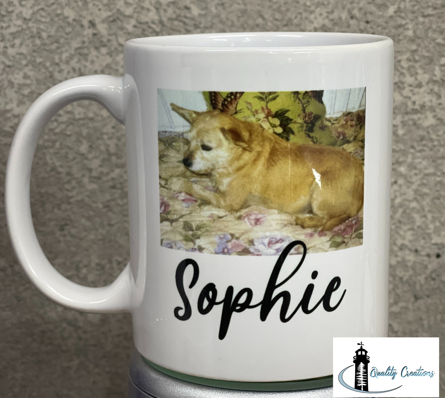 White mug with a custom photo of a dog named Sophie printed above the name in script font, shown on a grey surface
