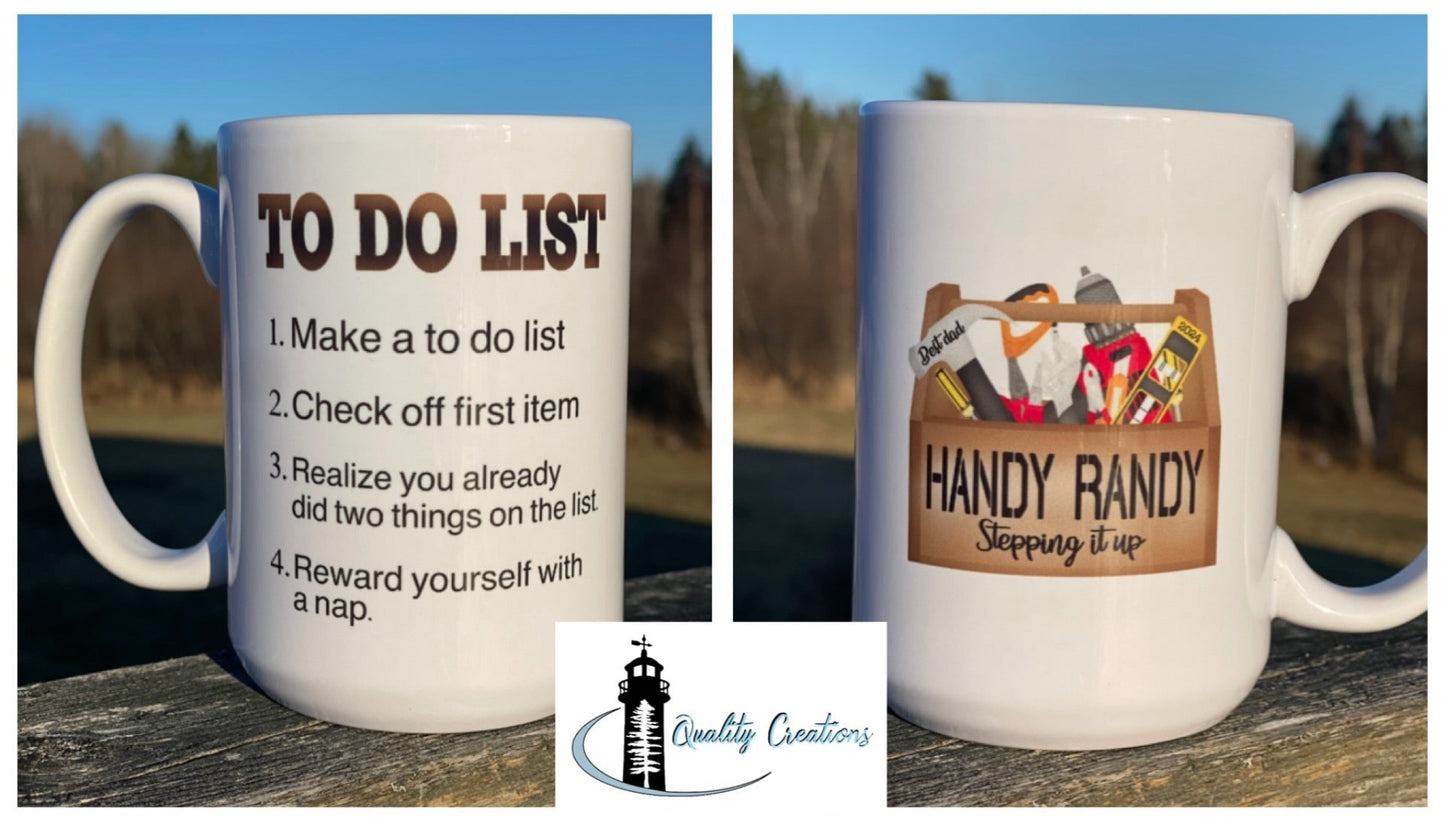 Two-sided white mug with a personalized tool-themed “Handy Randy” graphic and humorous to-do list, displayed on a wooden surface outdoors