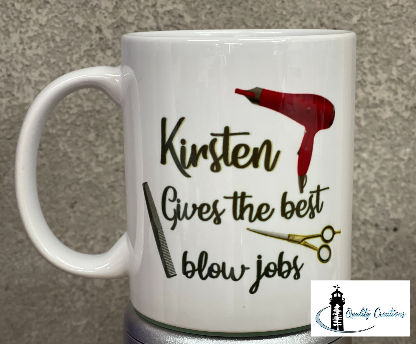 White mug with hairstylist-themed design and personalized text that includes a blow dryer, scissors, and comb graphic, displayed on a grey surface