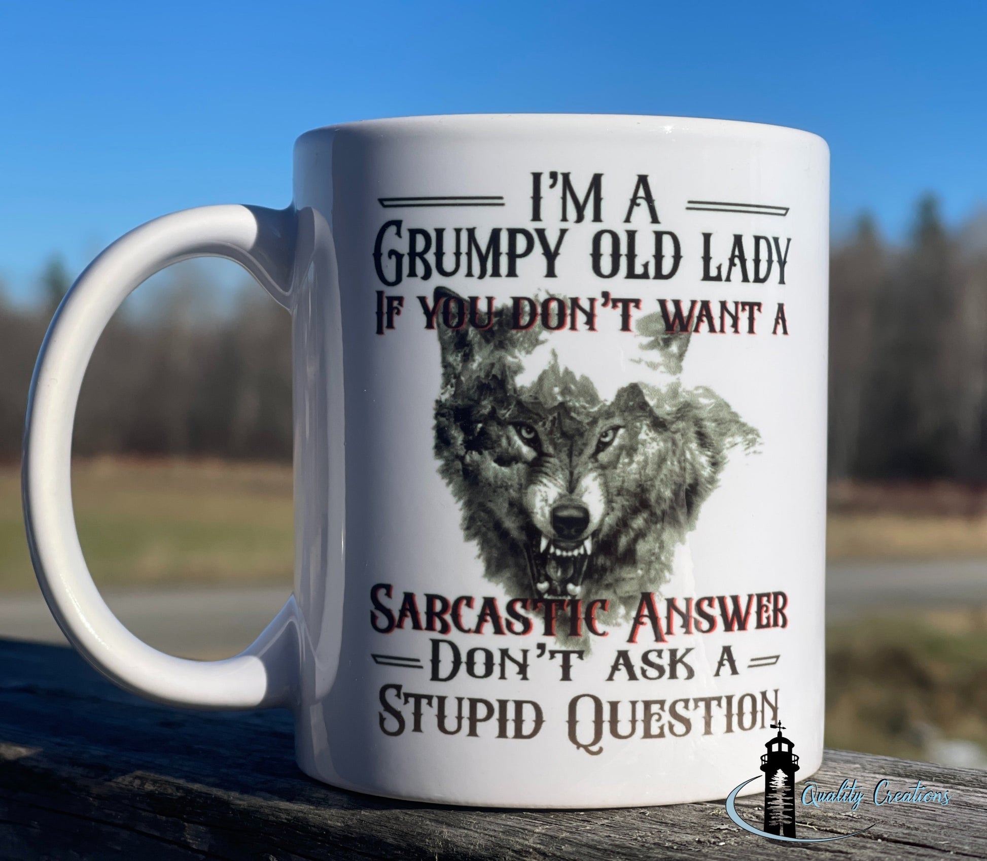 White mug with angry wolf graphic and the text: I’m a grumpy old lady. If you don’t want a sarcastic answer, don’t ask a stupid question